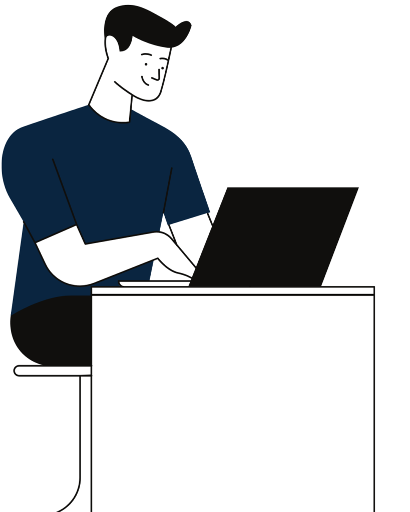IT professional working on a laptop at a desk